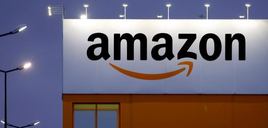 The logo of Amazon is seen at the company logistics center in Lauwin-Planque, northern France