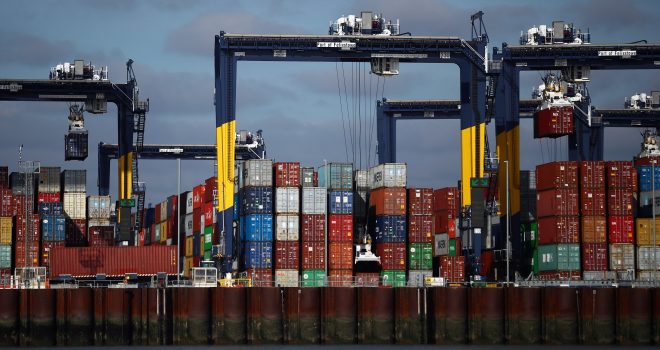 FILE PHOTO: A view shows stacked shipping containers at the port of Felixstowe, Britain, October 13, 2021. REUTERS/Hannah McKay
