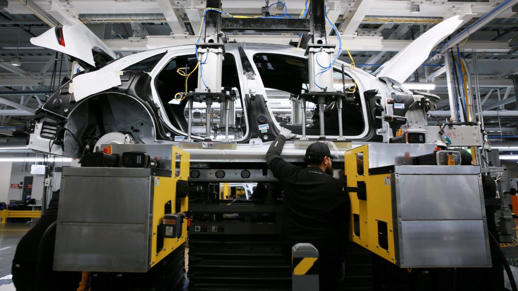 Workers assemble electric vehicles at the Lucid Motors plant in Casa Grande