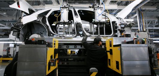 Workers assemble electric vehicles at the Lucid Motors plant in Casa Grande